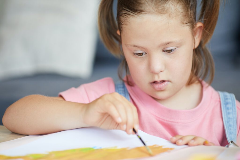 Disabled child painting